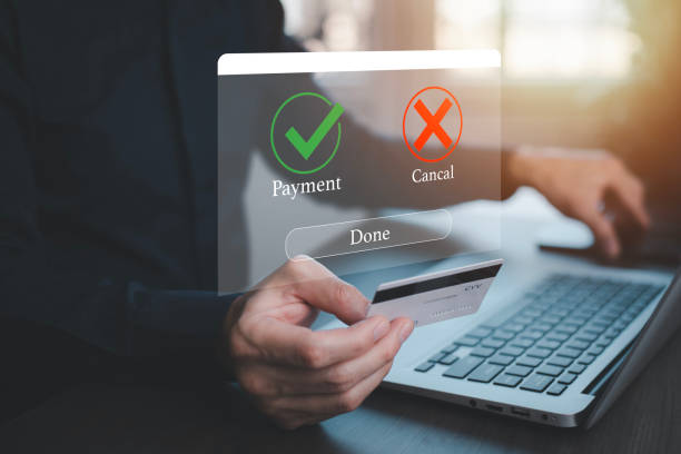 istock Laptop with Online payment ,Hand touch banking online bill payment Approved concept button, credit card and network connection icon on business technology virtual screen background 1498727829