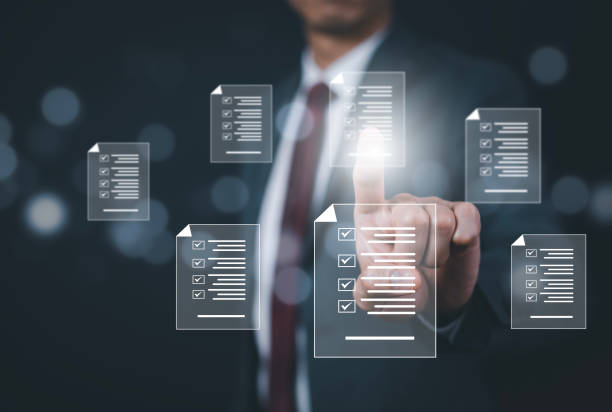 istock Business people hand touch Online documentation database, complete the online survey form, answer the test questions. Marked checklist on a clipboard. Human resources and management concept, BigData 1498728028