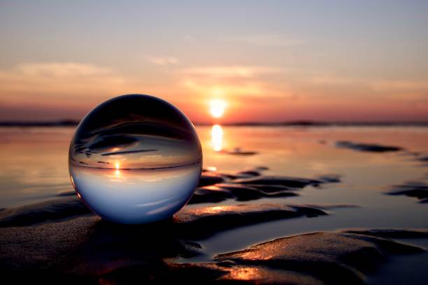 istock Crystal ball at sea during sunrise 1498729060