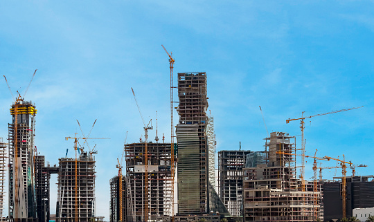 Riyadh, Saudi Arabia, KSA - June 18, 2013 buildings being constructed in the new King Abdullah Financial District in Riyadh with cloudy sky