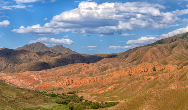 istock Scenic mountain landscape with red rocks and cloudy sky 1498729565