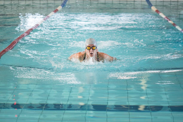 istock Woman butterfly swimming in a pool 1498730121
