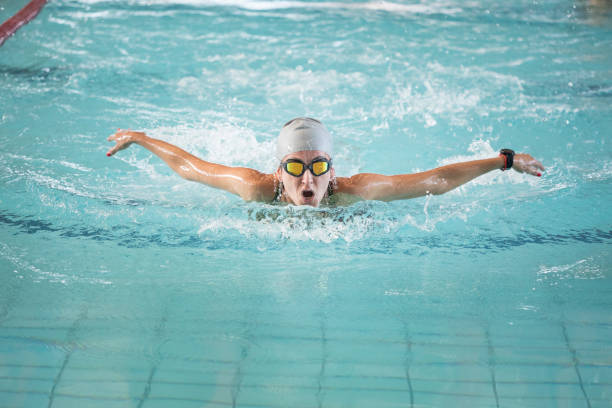 istock Woman butterfly swimming in a pool 1498730128