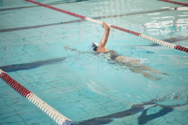 istock Woman swimming crawl in the pool 1498730248