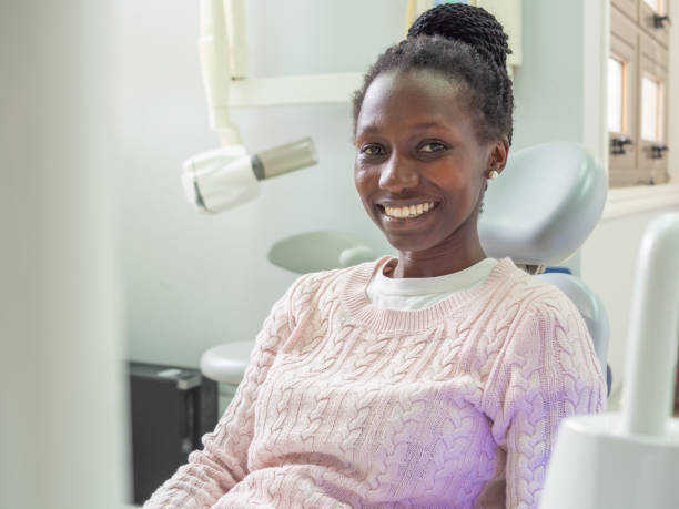 istock Young female patient at the dentist 1498732686