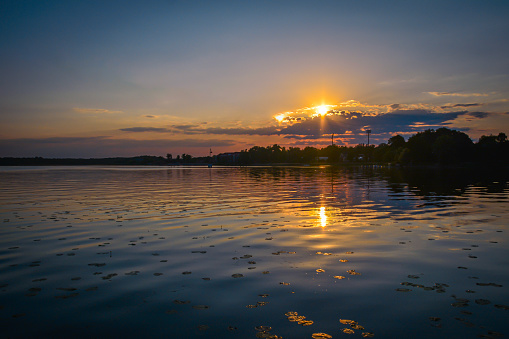 A tourist resort with a beautiful waterfront and a clean lake.