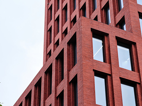 Red brick facade of a modern building in Shanghai, China