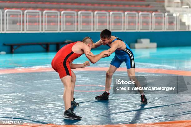 Blue Vs Red During Wrestling Match Stock Photo - Download Image Now - Wrestling, Sport, Child