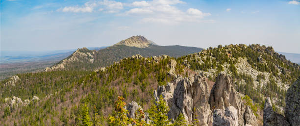 istock Summer landscape. Mountains covered with forest on a sunny summer day 1498738720