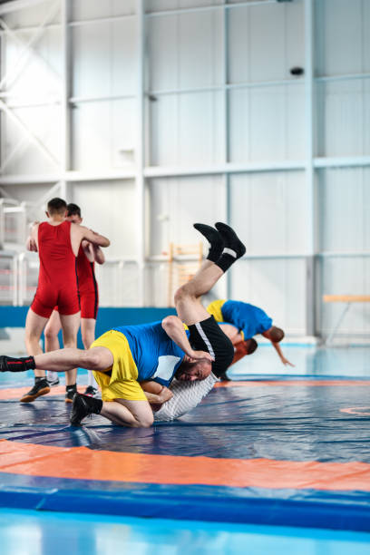istock Wrestling Technique Practiced By Wrestlers In Gym 1498739218