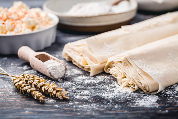 istock Baking preparation of savory pie with phyllo dough sheets stuffed with feta cheese 1498740884