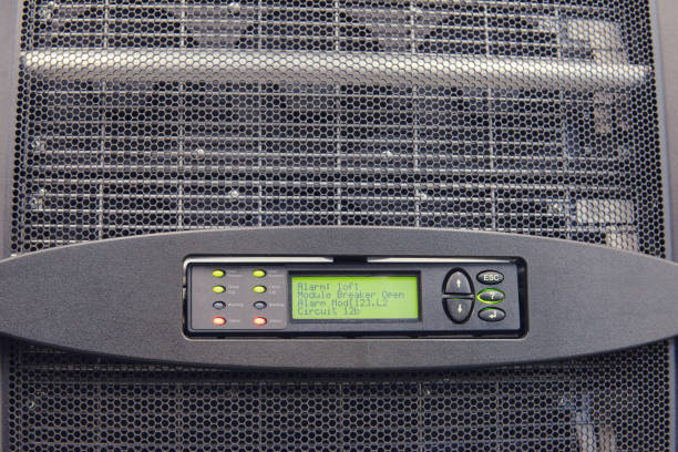 Control panel with alarm module of uninterruptible power supply system ups in server room, red light warning error