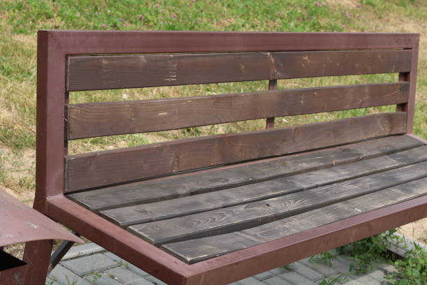istock photo of an empty bench in brown 1498743248
