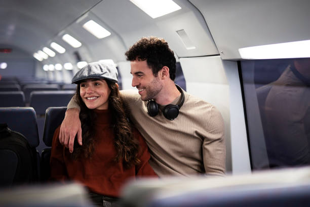 istock Loving couple travel by train. 1498747233