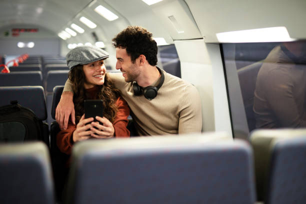 istock Loving couple travel by train. 1498747302