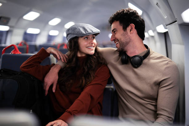 istock Loving couple travel by train. 1498747364