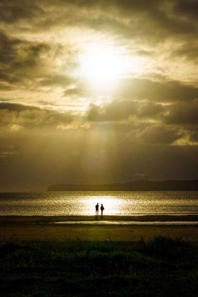 Couple in sunset light on the beach