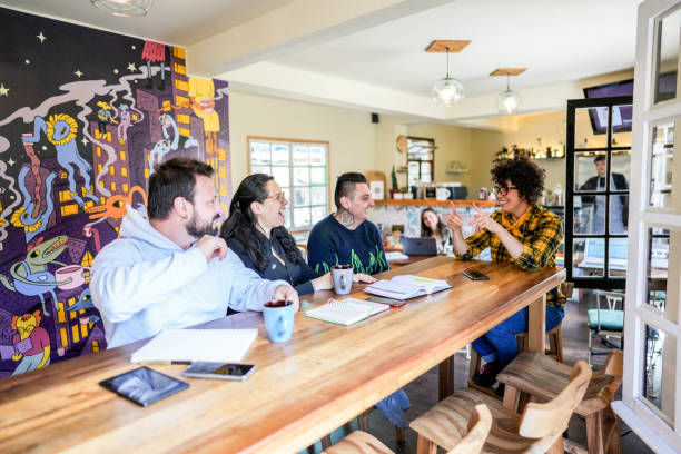 istock Colleagues doing a language sign class at a coffee shop 1498753545