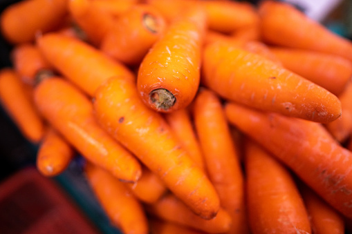 Display of winter vegetables in baskets: carrots, potatoes, turnips, leeks, onions, cabbage, cauliflower, eggplant