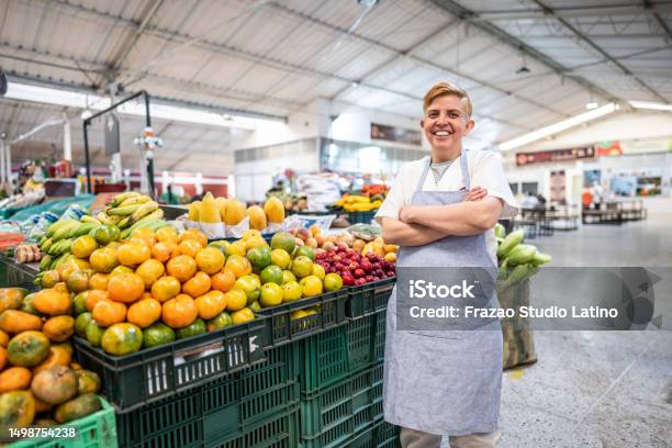 Portrait Of A Mature Female Retail Clerk Working At A Greengrocers Shop Stock Photo - Download Image Now
