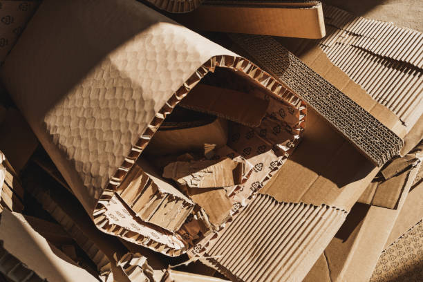 istock Stack of Cardboard Waste in sunlight. Concepts of Paper Recycling and Waste Sorting 1498756317