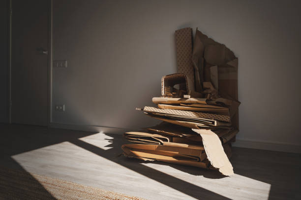 istock Stack of Cardboard Waste at home. Concepts of Paper Recycling and Waste Sorting 1498756971