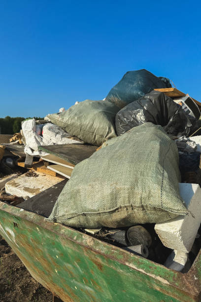 istock Container full of Construction waste and debris on a construction site 1498759729