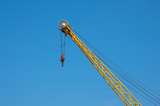 yellow crane in the port and blue sky background