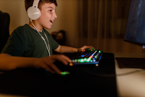 istock Boy Playing Online Video Game on His Personal Computer 1498761600