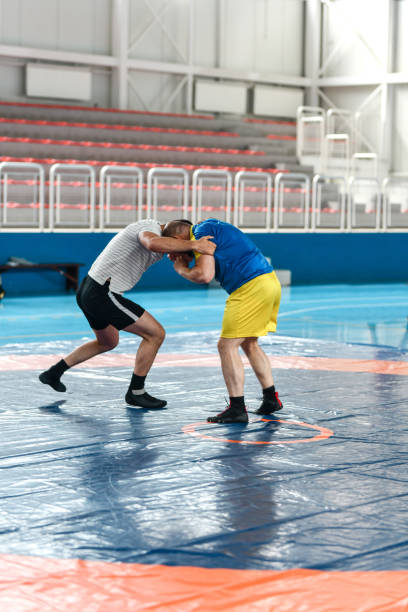 istock Pushing Contest By Two Senior Wrestlers During Practice Session In Gym 1498765181