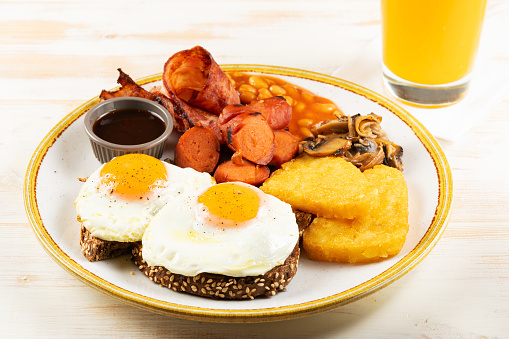 Îreakfast background with fried eggs and nuggets. Food background.