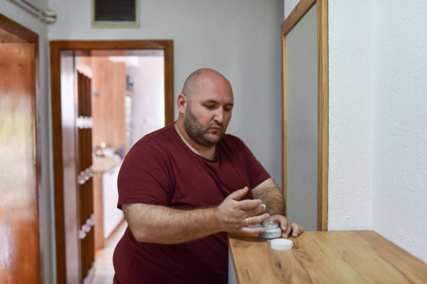 Balding Male Applying Facial Cream