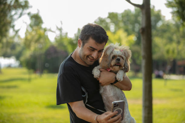 istock A man is taking a selfie with his dog. 1498770831