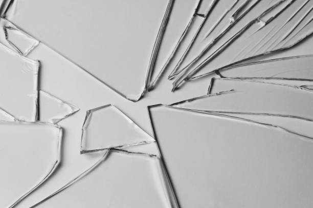 istock Broken glass pile pieces of texture and background isolated on white, cracked window effect. Emergency condition. 1498772253