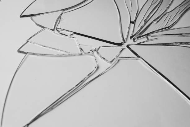 istock Broken glass pile pieces of texture and background isolated on white, cracked window effect. Emergency condition. 1498772254