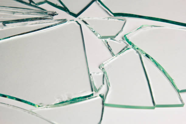 istock Broken glass pile pieces of texture and background isolated on white, cracked window effect. Emergency condition. 1498772267