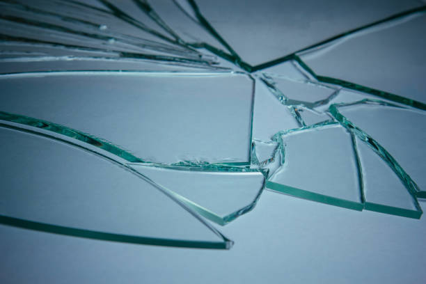 istock Broken glass pile pieces of texture and background isolated on white, cracked window effect. Emergency condition. 1498772276