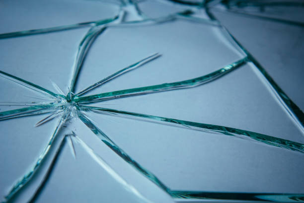 istock Broken glass pile pieces of texture and background isolated on white, cracked window effect. Emergency condition. 1498772284