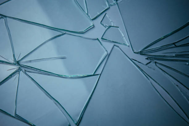 istock Broken glass pile pieces of texture and background isolated on white, cracked window effect. Emergency condition. 1498772303