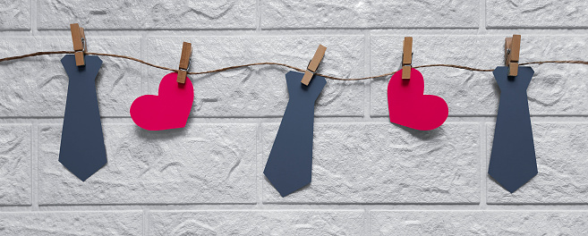 Garland of ties and hearts. Preparation for holiday. Header for website, blog, advertisement, flyer, poster.