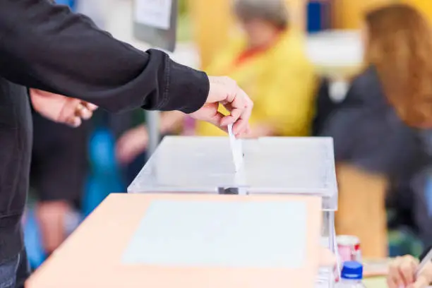 political referendum polling choice voter background with copy space. democratic system. Hispanic voter holding an envelope in an electoral college