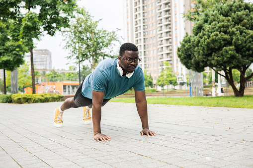 Young man is exercising outdoors