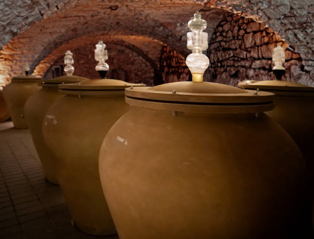 istock Wine aging in modern clay amphorae in a wine cellar 1498785686