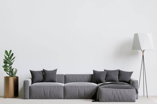 istock Contemporary living room with a grey sofa, lamp, and decorative plants. 3d rendering. 1498793410