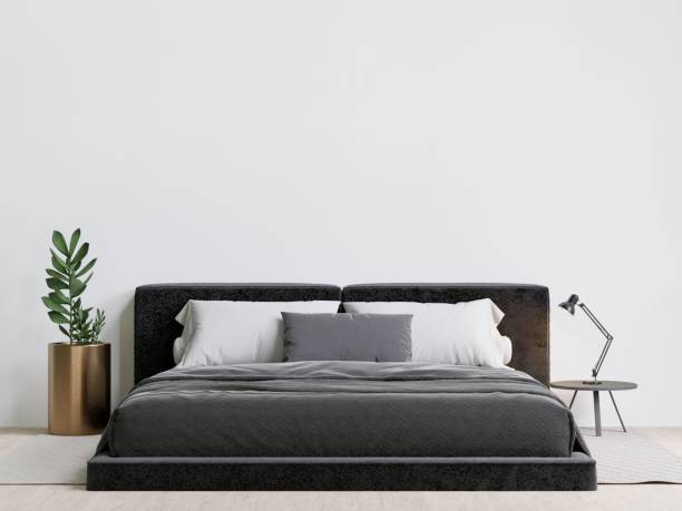 istock Contemporary bedroom with a luxurious bed, decorative plants, and a table lamp. 3d rendering. 1498793412
