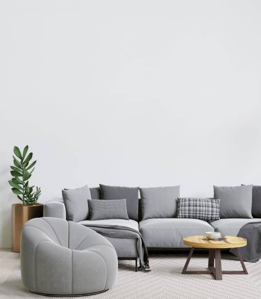 istock this room has white walls and a gray sectional couch next to a table and chairs 1498793417