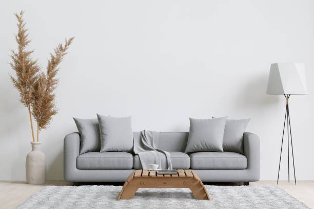 istock Contemporary living room with a grey sofa, decorative plants, lamp, and coffee table. 3d rendering. 1498793428