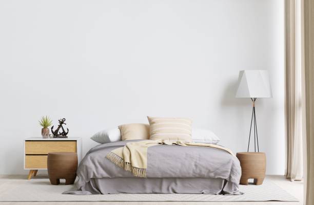 istock Contemporary bedroom with a soft bed against a white wall. 3d rendering. 1498793449