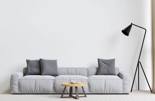 istock Contemporary living room with a grey sofa, lamp, and coffee table. 3d rendering. 1498793468