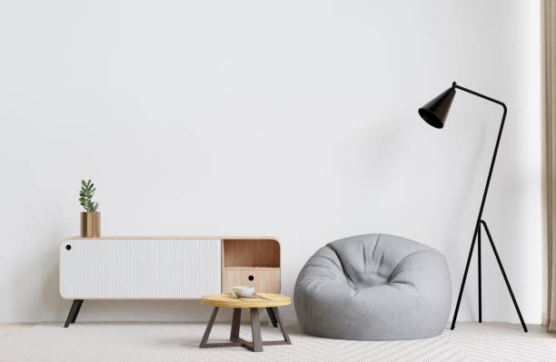 istock Modern living room with a bean bag, drawer, lamp, and coffee table. 3d rendering. 1498793474